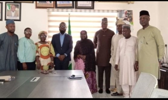 The Acting Executive Director, NIWRMC, Mrs Sakinatu Abbo Jimeta (M), Management Staff of the Commission and representatives of Nigerian Breweries PLC in a group photograph