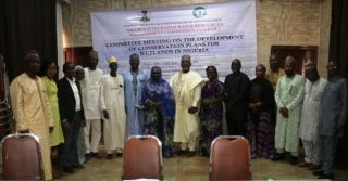 Members of the Committee in a group photograph at the meeting in Kano